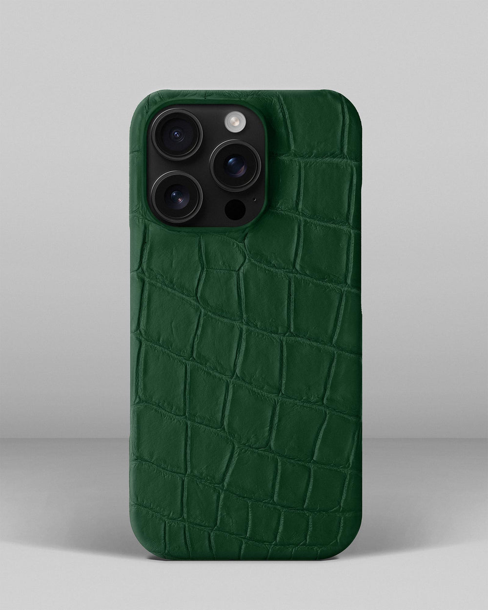 Ciemnozielone etui obite skórą krokodyla do iPhone 15 Pro